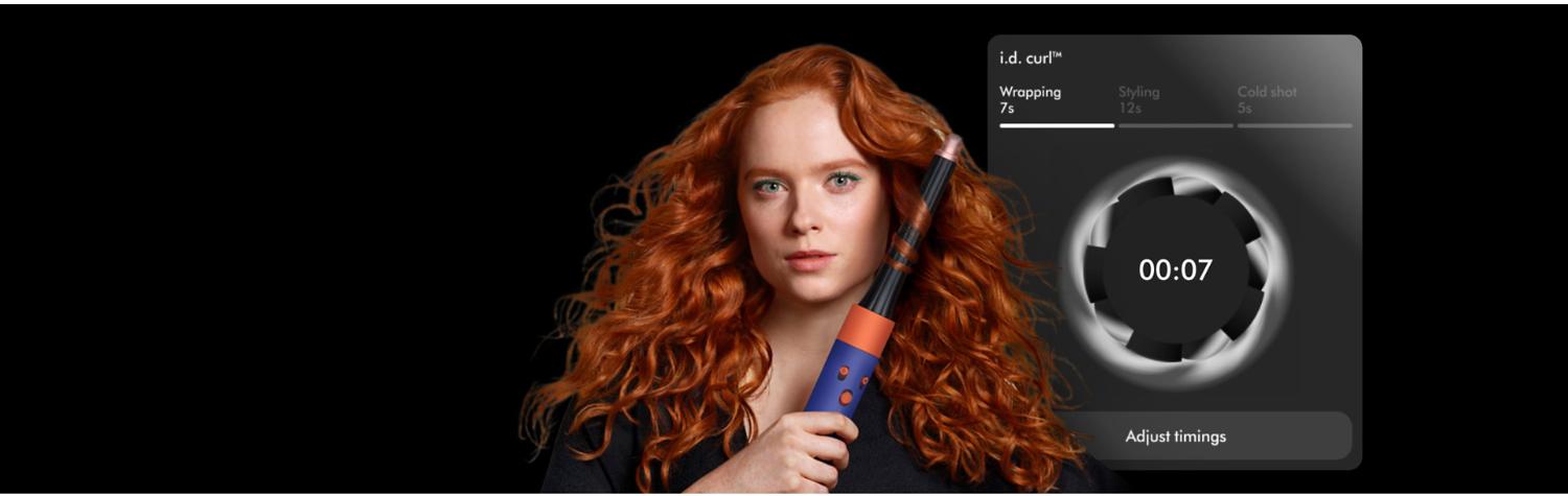 Owner curling her hair with the Dyson Airwrap i.d. multi-styler and dryer featuring i.d. curl.